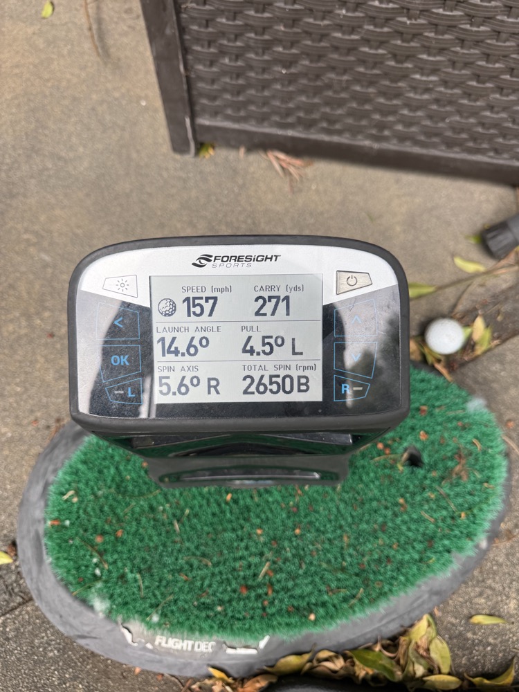 A Foresight launch monitor showing ball speed, carry, launch angle and spin from a practice shot.